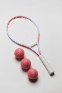 Kaboompics - Tennis Racket and Pink Tennis Balls Flat Lay