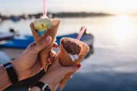 Kaboompics - Hands Holding Two Ice Cream Cones by the Seaside at Sunset
