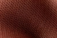 Kaboompics - Dark terracotta open mesh fabric macro texture background
