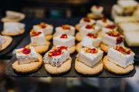 Kaboompics - Cheese Canapes on Crackers with Red Jam at Madrid Market