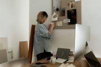 Kaboompics - Interior Designer Working beside Moodboard, Monitor and Material Samples