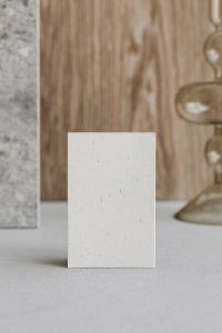 Kaboompics - Vertical Blank Card Mockup with Wood Panel, Marble Sample and Blurred Glass Decor