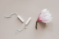 Kaboompics - White Tampons and Pink Magnolia on Beige, Minimal Feminine Care Flat Lay