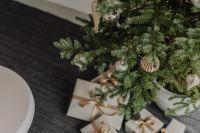 Kaboompics - Wrapped Christmas Gifts Beneath Decorated Tree Branches
