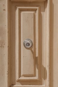Kaboompics - Close-Up Ornate Door Panel with Vintage Metal Knob