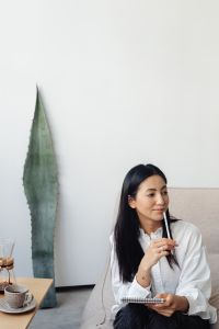 Kaboompics - Woman Writing Notes in a Calm Living Room