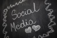 Kaboompics - Social Media Chalk Lettering with Hand-Drawn Decorative Doodles on a Blackboard