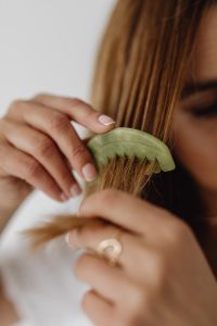 Kaboompics - Close-Up of Jade Comb Brushing the Hair Ends