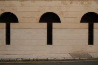 Kaboompics - Repeating Arched Windows on Malaga Building