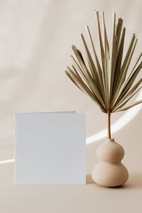 Kaboompics - Blank Card Mockup and Palm Frond Vase with Copy Space