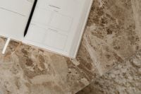 Kaboompics - Open Planner and Black Pen on a Brown Marble Table, Copy Space