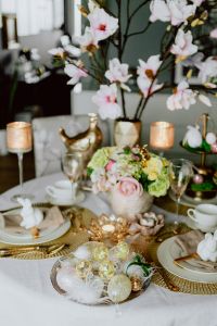 Kaboompics - Vertical Easter Dining Table with Magnolia Branches, Floral Centerpiece, Candles and Bunny Plates