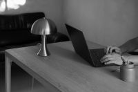 Kaboompics - Man Typing on a Laptop Beside a Table Lamp
