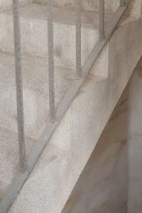 Kaboompics - Close-Up Pale Stone Staircase with Metal Handrail