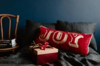 Kaboompics - Christmas Bedroom with Dark Bedding and Red Pillow