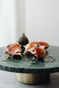Kaboompics - Side View Of Prosciutto-Wrapped Figs On Slate Plate