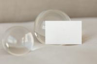 Kaboompics - Horizontal Blank Business Card Between Clear Glass Spheres