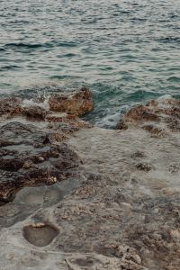 Kaboompics - Shallow Seawater Channel Framed by Weathered Coastal Rocks