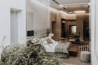 Kaboompics - Modern Bedroom with Blue Upholstered Bed, Tufted Bench and Indoor Greenery