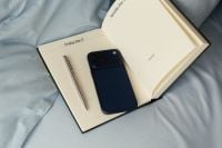 Kaboompics - January 2027 Daily Planner With Smartphone and Pen on Blue Bedding