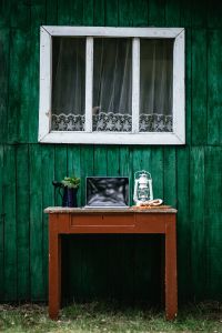 Vintage Home Office With Laptop, Coffee and Rustic Decor