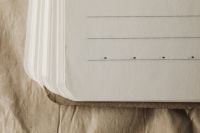 Kaboompics - Notebook Stack Mockup On Wrinkled Paper Background