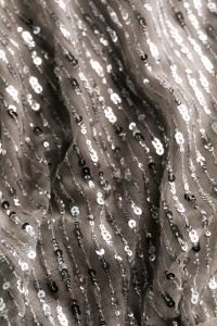 Kaboompics - Black and Silver Sequin Fabric Waves