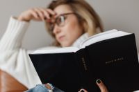 Kaboompics - Close-Up of Woman Reading a Black Holy Bible