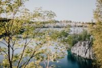 Kaboompics - Spring Trees Framing a Limestone Quarry Lake