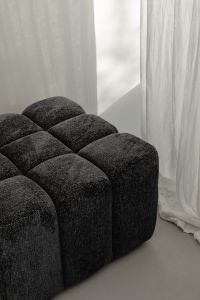 Kaboompics - Close-Up of Black Textured Ottoman by Sheer Curtains