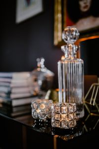 Kaboompics - Tall Glass Decanter and Candlelight in a Cozy Living Room
