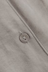Kaboompics - Gray Garment Fabric With Button and Seam Detail