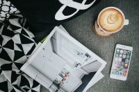 Kaboompics - Top View Coffee Cup, Open Magazine and Smartphone with Throw Blanket