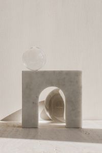 Kaboompics - Glass Sphere on Marble Block With Arch Opening