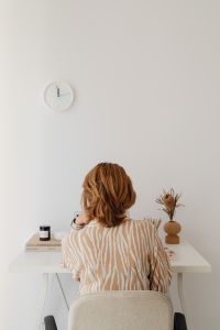 Minimal Neutral Home Office with Woman Working from Home