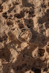 Kaboompics - Gold Ring Set Against a Weathered Limestone Background