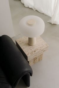 Kaboompics - White Table Lamp on Travertine Side Table Beside Black Leather Sofa