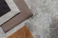 Kaboompics - Neutral Bouclé Upholstery Fabric Swatches with Wood Texture Sample