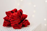 Kaboompics - Red Ribbon Gift Bows with Soft Bokeh on Neutral Background