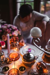 Kaboompics - Blurred Woman, Pink Flowers and White Christmas Ornament
