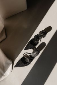 Kaboompics - Black Woven Slingback Heels in Strong Sunlight