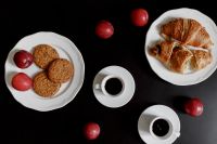 Kaboompics - Breakfast served with coffee, croissants, cookies and plums