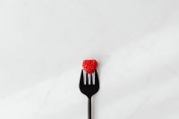 Kaboompics - Single Raspberry On Fork Minimal Still Life
