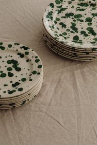 Kaboompics - Top-Down Green Splatter Plate Stacks on Neutral Linen