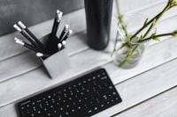 Kaboompics - Close-Up of Black Pencils and Green Branches on a White Desk