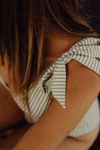Kaboompics - Striped Swimsuit Strap and Shoulder in a Minimal Fashion Close-Up