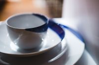 Kaboompics - Gray Ceramic Cup on Saucer with Blue Plate