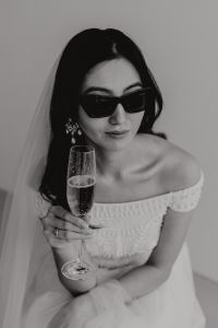 Kaboompics - Black and White Bridal Portrait With Sunglasses and a Champagne Flute