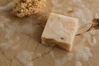 Kaboompics - White Soap Bar and Sea Sponge on a Foamy Surface