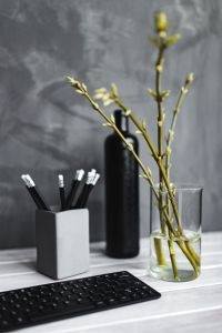 Minimal Home Office Styling with Black Keyboard, Pencils and Greenery